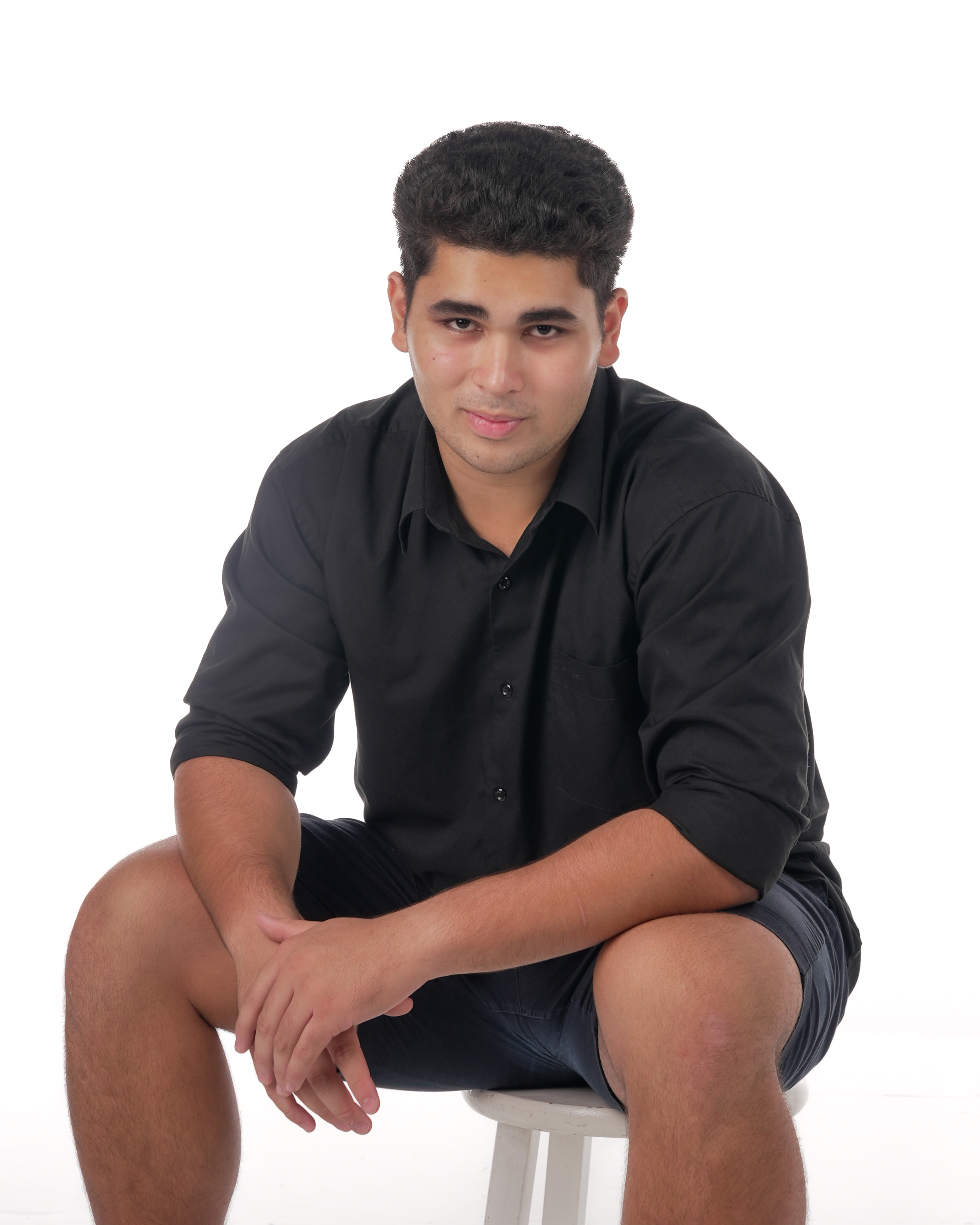 Seated studio portrait of Genesis Babauta