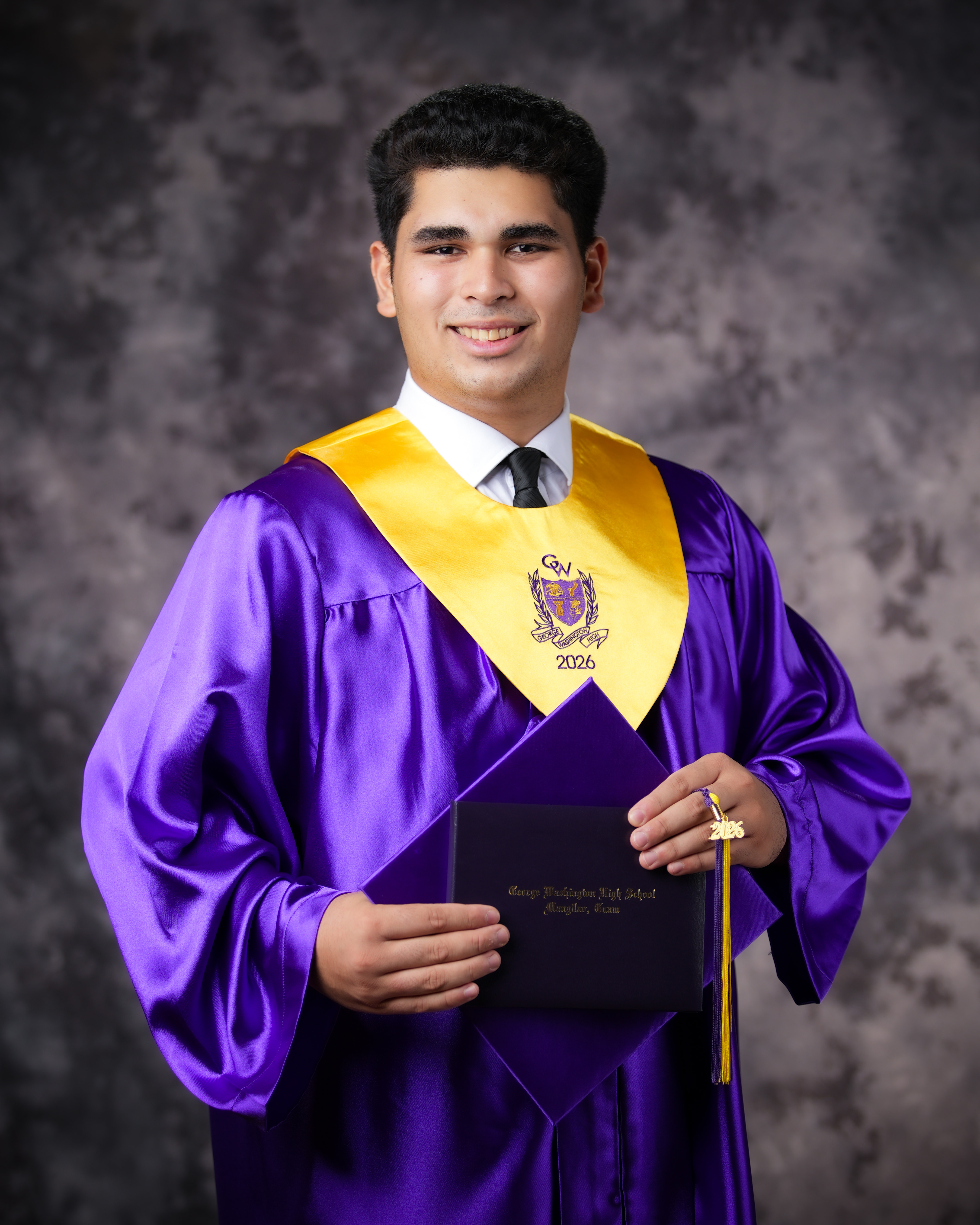 Genesis Babauta in his George Washington High School graduation gown, Class of 2026