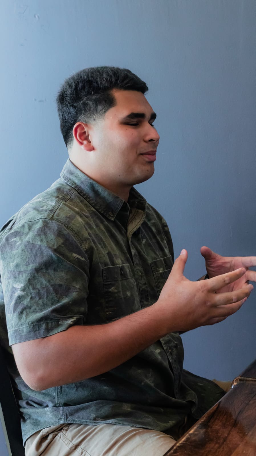 Genesis Babauta gesturing while leading the Lunch with the Leaders conversation