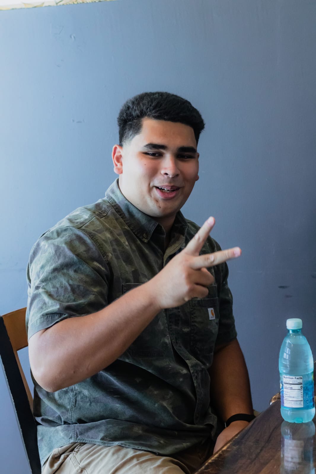 Genesis Babauta smiling mid-conversation during Lunch with the Leaders