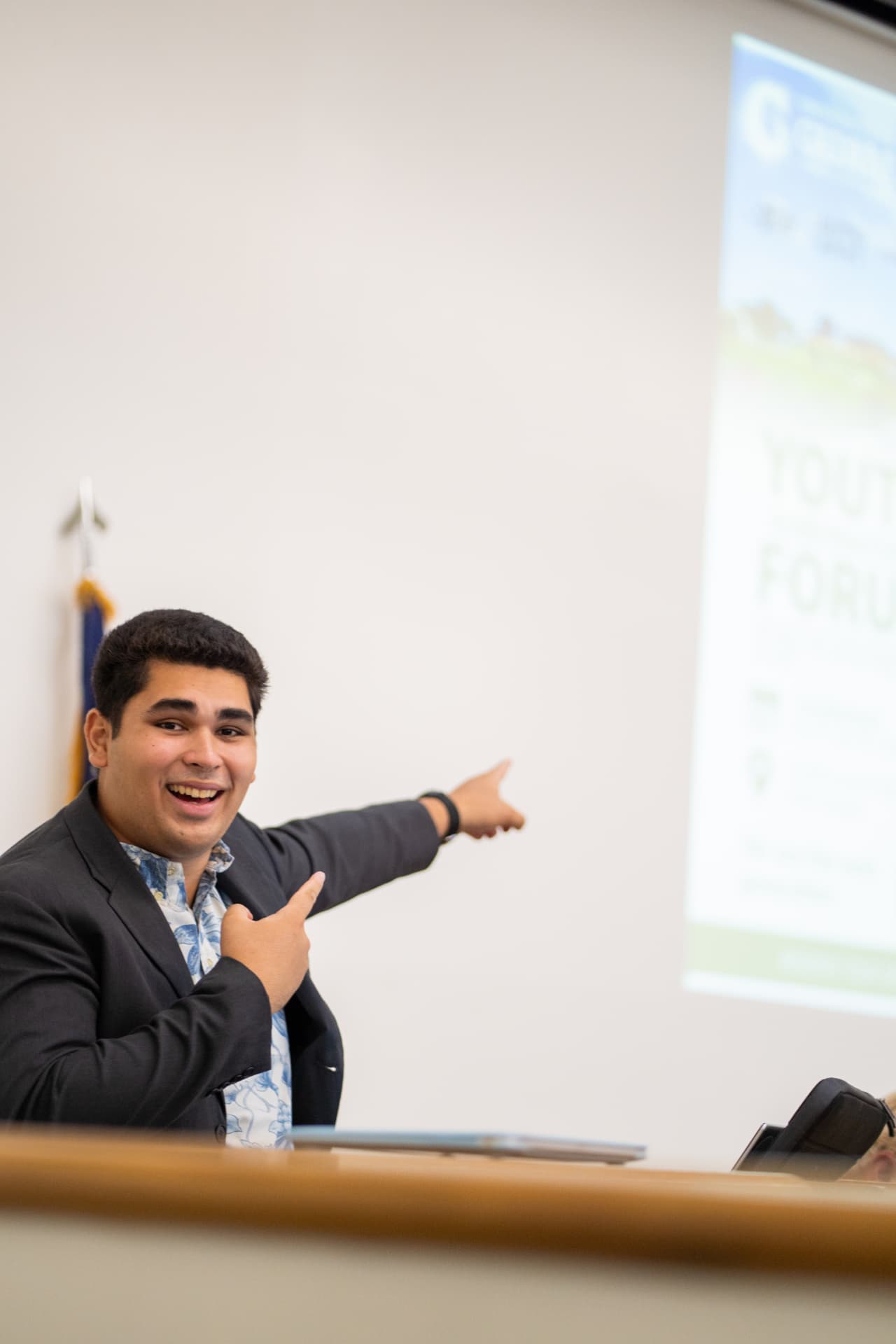 Genesis Babauta pointing to the crowd while moderating